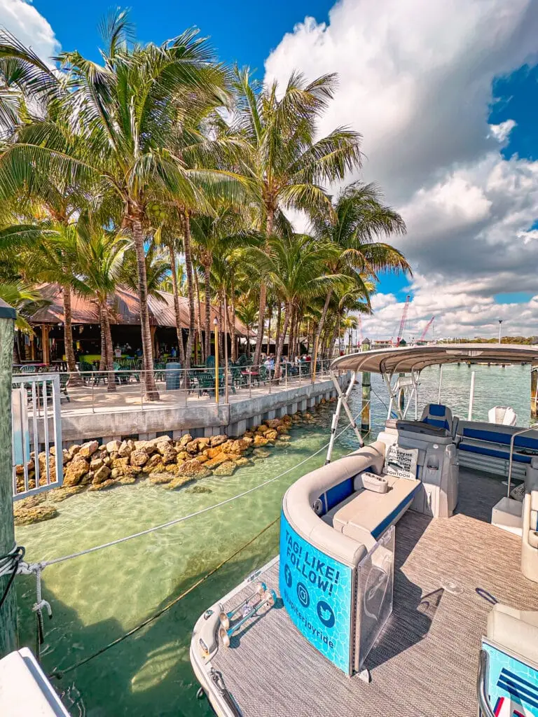 Spacious Tritoon Boat docked at the Square Grouper in Jupiter